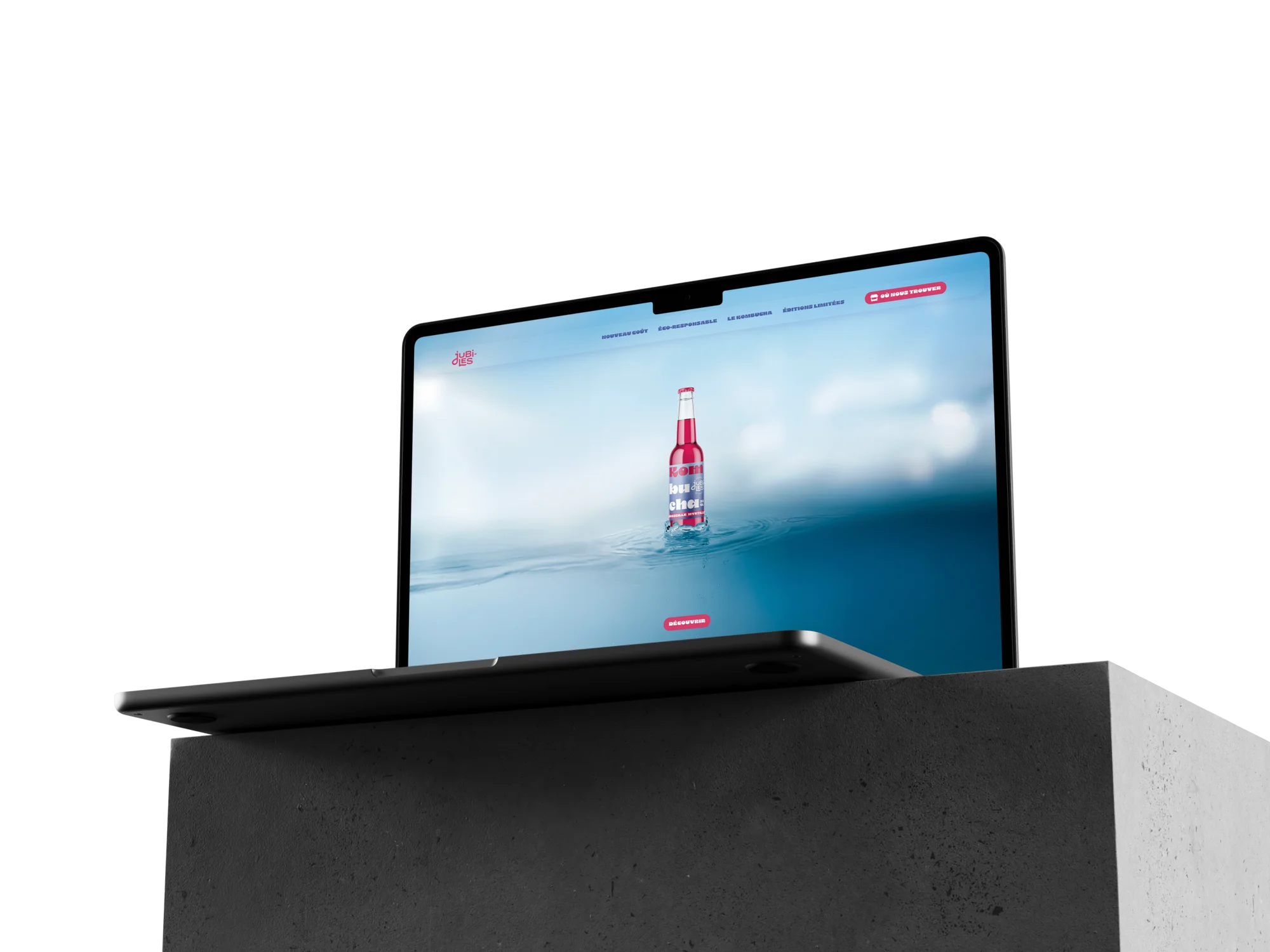 Mockup de MacBook ouvert, affichant le design d'une page du site web Jubiles.